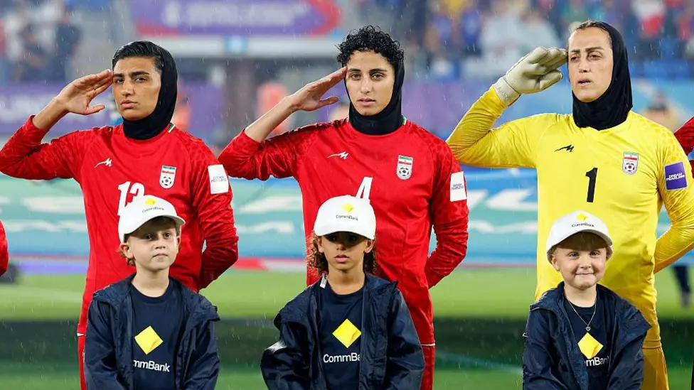 After not singing the national anthem before their opening game, the Iran players sang and saluted before playing Australia and the Philippines